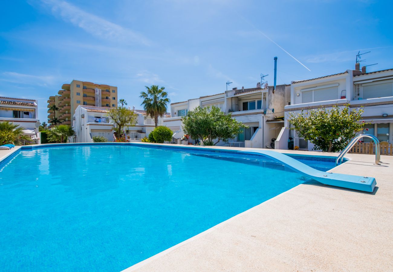 Apartment with communal pool near the beach.